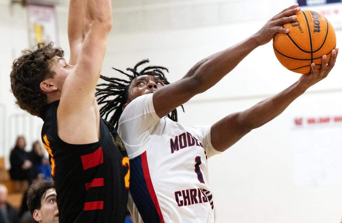Modesto Christian’s Jeremiah Bernard challenges Berkeley’s Will Polishuk during a non-league game at Modesto Christian High School in Salida, Calif., Saturday, Dec. 16, 2023.