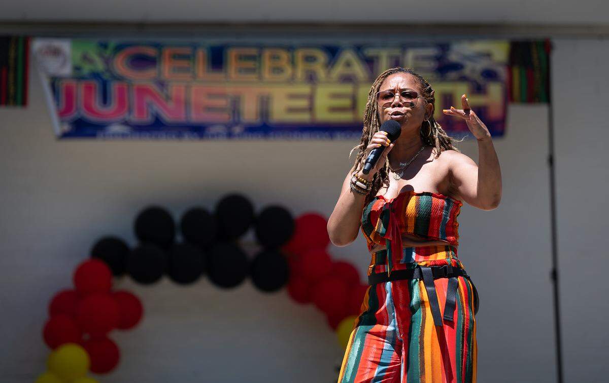 Angela Drew performs a spoken word poem during the Juneteenth celebration at Graceada Park in Modesto, Calif., Saturday, June 15, 2024.