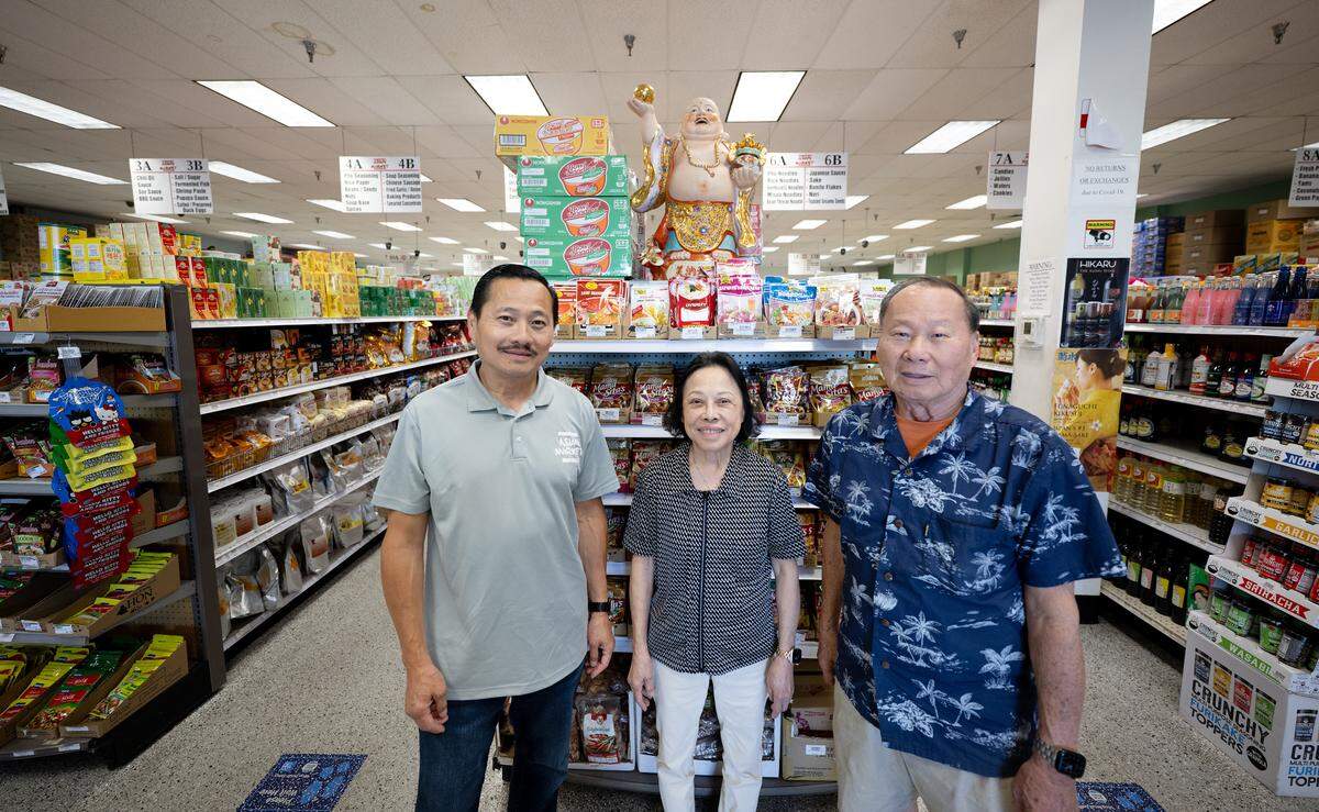 Asian Market owner Trong Vuong with his parents Nai Truong, middle, and Hanh Vuong, right, who established the market in 1984. Photographed in Modesto, Wednesday, July 2, 2025.