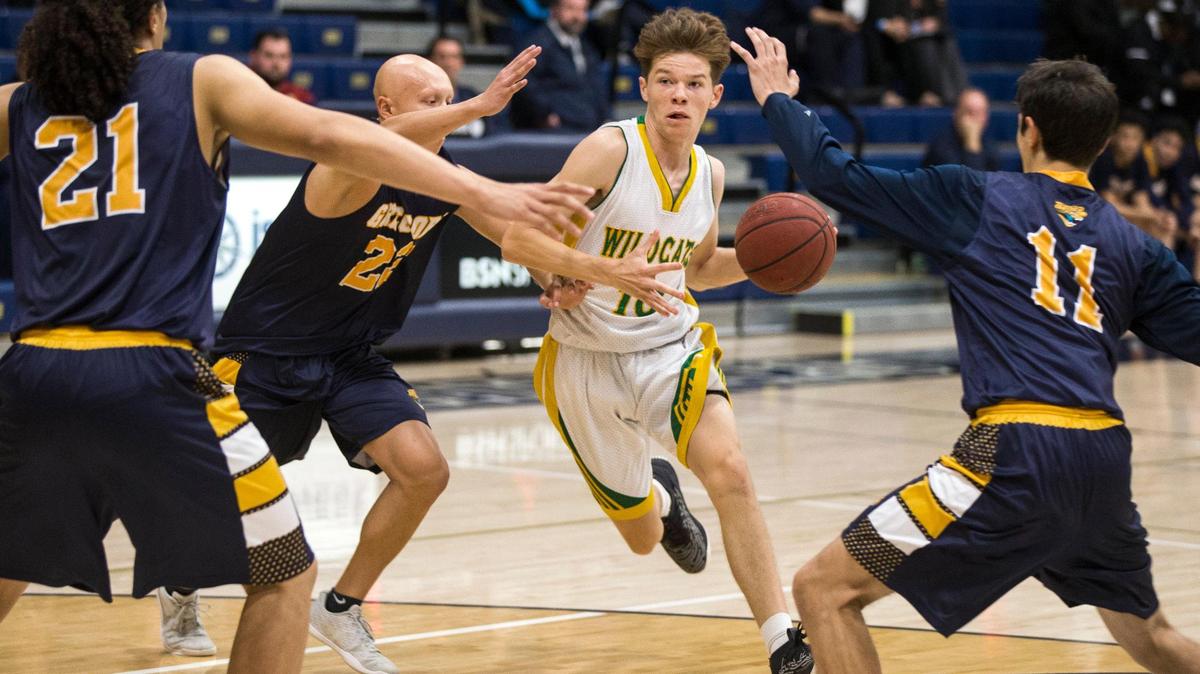 Logan Sewell, of Sonora High drives to the hoop between Gregori Highs defense during the second round of the Mark Gallo Invitational at Central Catholic Thursday Dec. 13, 2018.