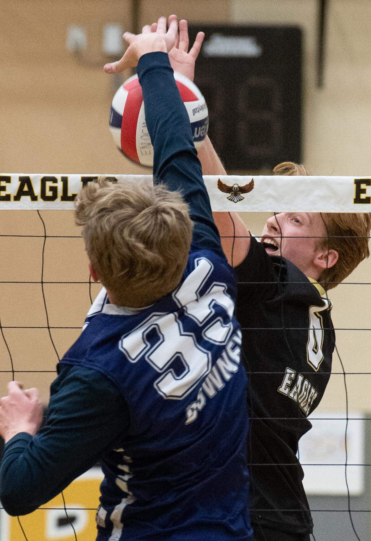 Enochs’ Blake Keller (6) and Downey’s Ryder Rockwood battle at the net during the Central California Athletic League match at Enochs High School in Modesto, Calif., Tuesday, April 4, 2023.