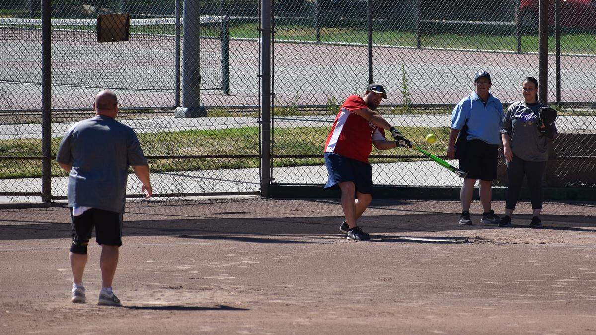 Friends play softball in Davis Community Park on Sunday, July 14, 2019. Daily high temperatures in Modesto will fall from the mid-90s to the low 90s by the weekend, the National Weather Service predicts.