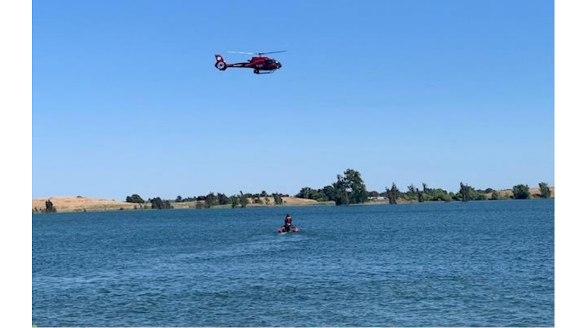 First responders search for a missing swimmer at Woodward Reservoir on Sunday, July 9, 2023.