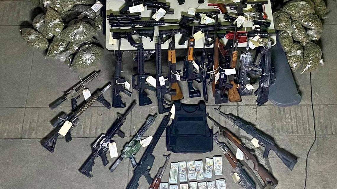 Modesto Police seized 80 guns and more than 120 pounds of processed marijuana during searches at five locations on Thursday.