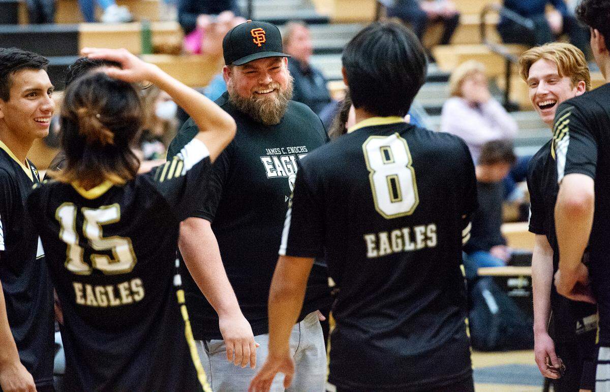 Enochs coach Spencer Barclay speaks to his team during a timeout during the Central California Athletic League match with Downey at Enochs High School in Modesto, Calif., Tuesday, April 4, 2023.