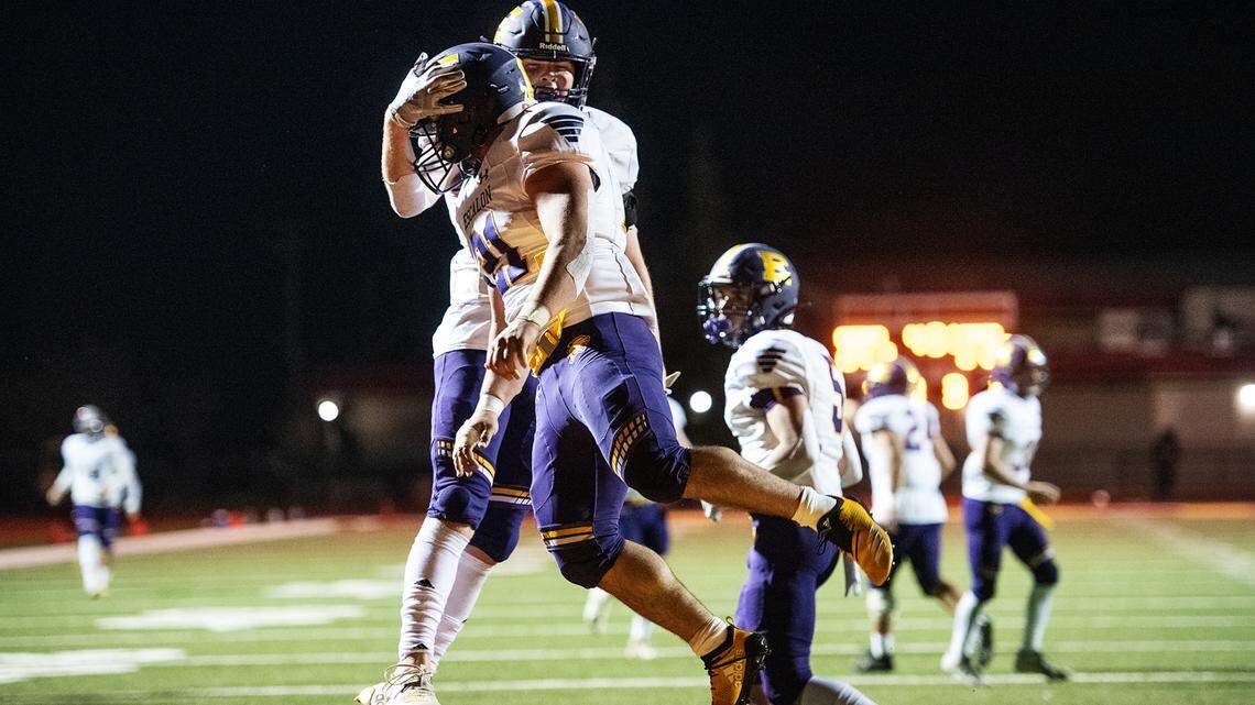 Escalon’s Luke Anderson celebrates a touchdown with teammate Logan Webster during the Valley Oak League game with Oakdale in Oakdale, Calif., on Friday, March 19, 2021. Oakdale won the game 38-35.