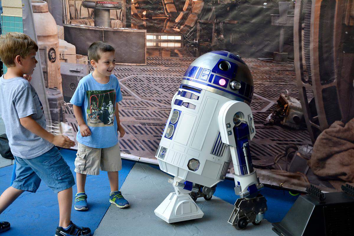 May The Fourth Star Wars Day brought out hundreds to Tenth Street Place May 4, 2018 in Modesto, Calif. The free public event included Star Wars cosplayers, live music and a performance by the Beyer High band. Pictured Ezekiel Lecher, 5, and Caleb Clements, 6, of Modesto check out R2-D2.