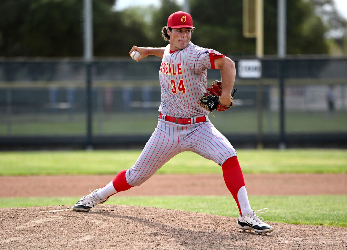Oakdale’s Landon Schutte delivers a pitch during the in the Valley Oak League game with Patterson at Oakdale High School in Oakdale, Monday, April 7, 2025.