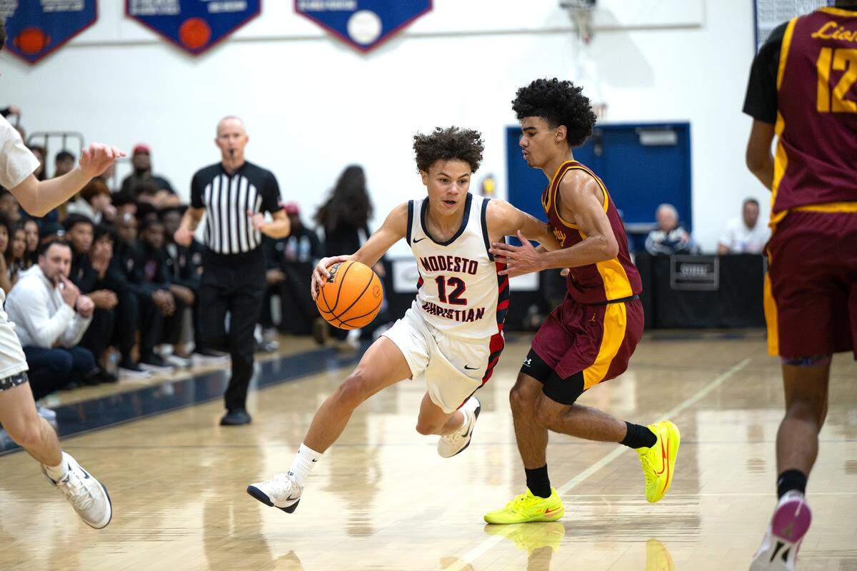 Modesto Christian’s Xavier Powell moves the ball during Holiday Hoop Classic with Liberty at Modesto Christian High School in Salida, Tuesday, Dec. 30, 2025.