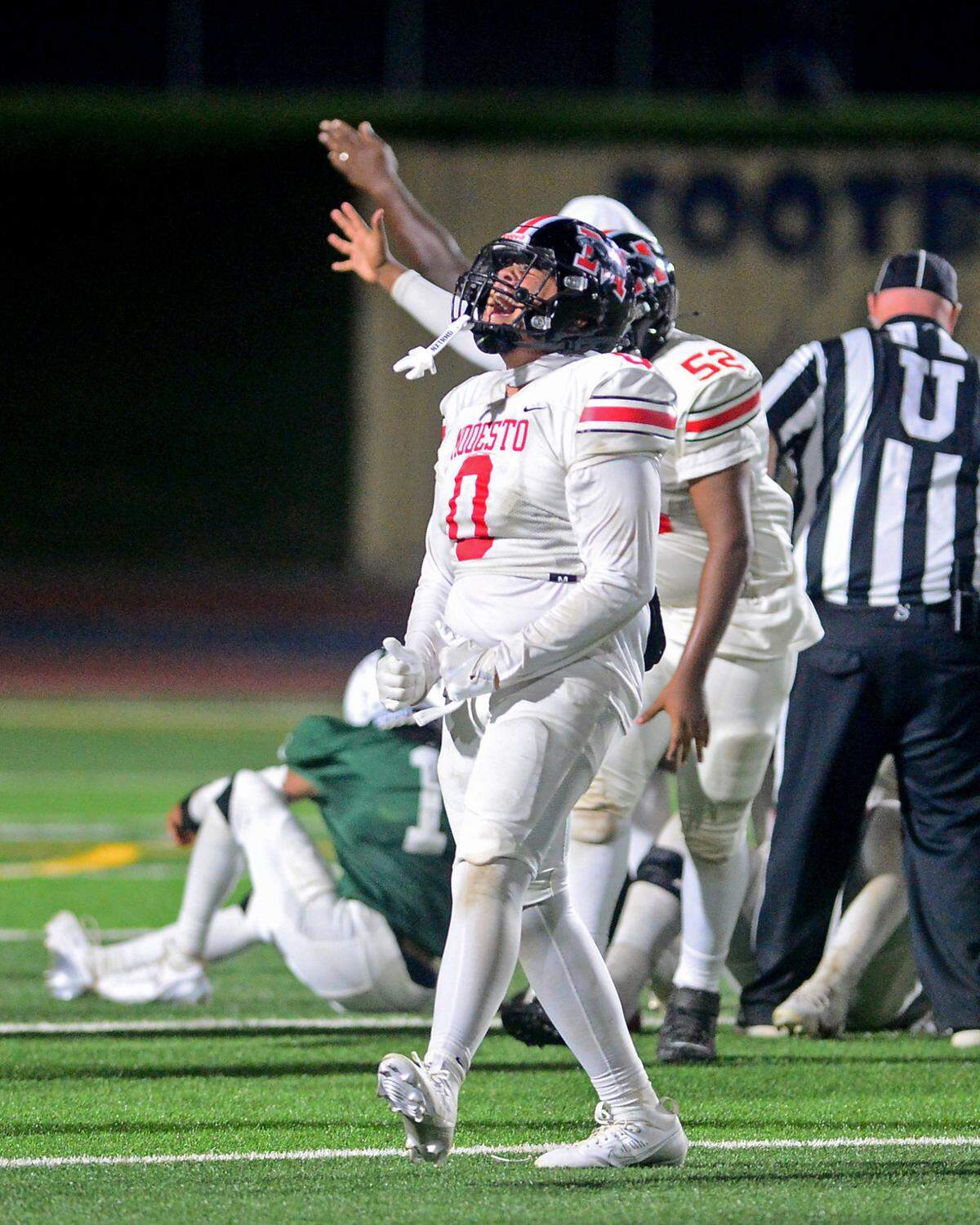 Modesto High defensive lineman Devin Johnson (0) celebrates a fumble recovery during a game between Modesto High School and Central Valley High School at Gregori High School in Modesto, Calif., on Sept. 13, 2024.