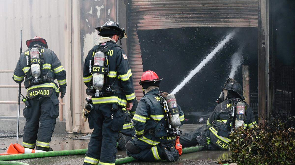 Firefighters battle a five-alarm fire at The Salvation Army Family Thrift Store and Donation Center on McHenry Avenue at Bangs Avenue in Modesto, Calif., on Thursday, June 2, 2022.