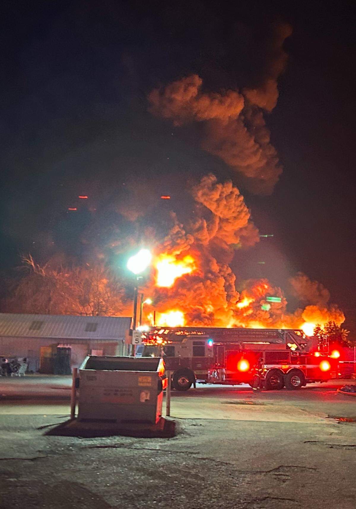 A fire in a large commercial yard on the 2000 block of Yosemite Boulevard early Wednesday, Feb. 19, 2025, burned construction trailers and other equipment and threatened a neighborhood. Modesto Fire crews quickly brought it under control.