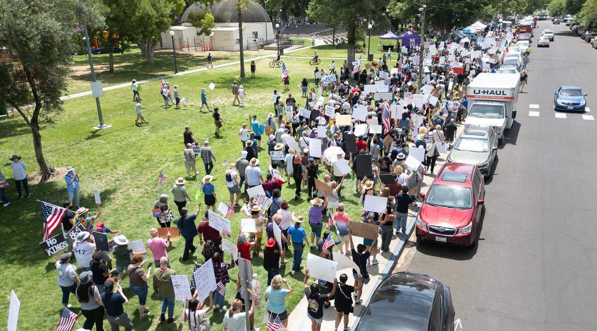 Protesters march in Graceada Park during the “No Kings” protest in Modesto, Saturday, June 14, 2025.