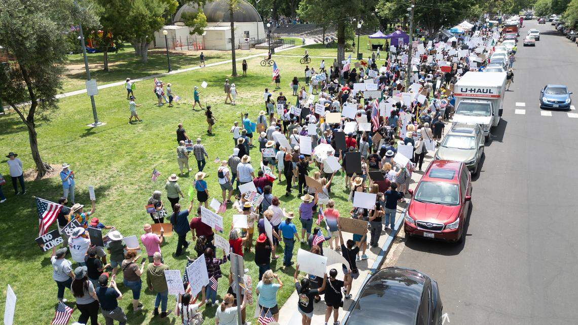 Protesters march in Graceada Park during the “No Kings” protest in Modesto, Saturday, June 14, 2025. 