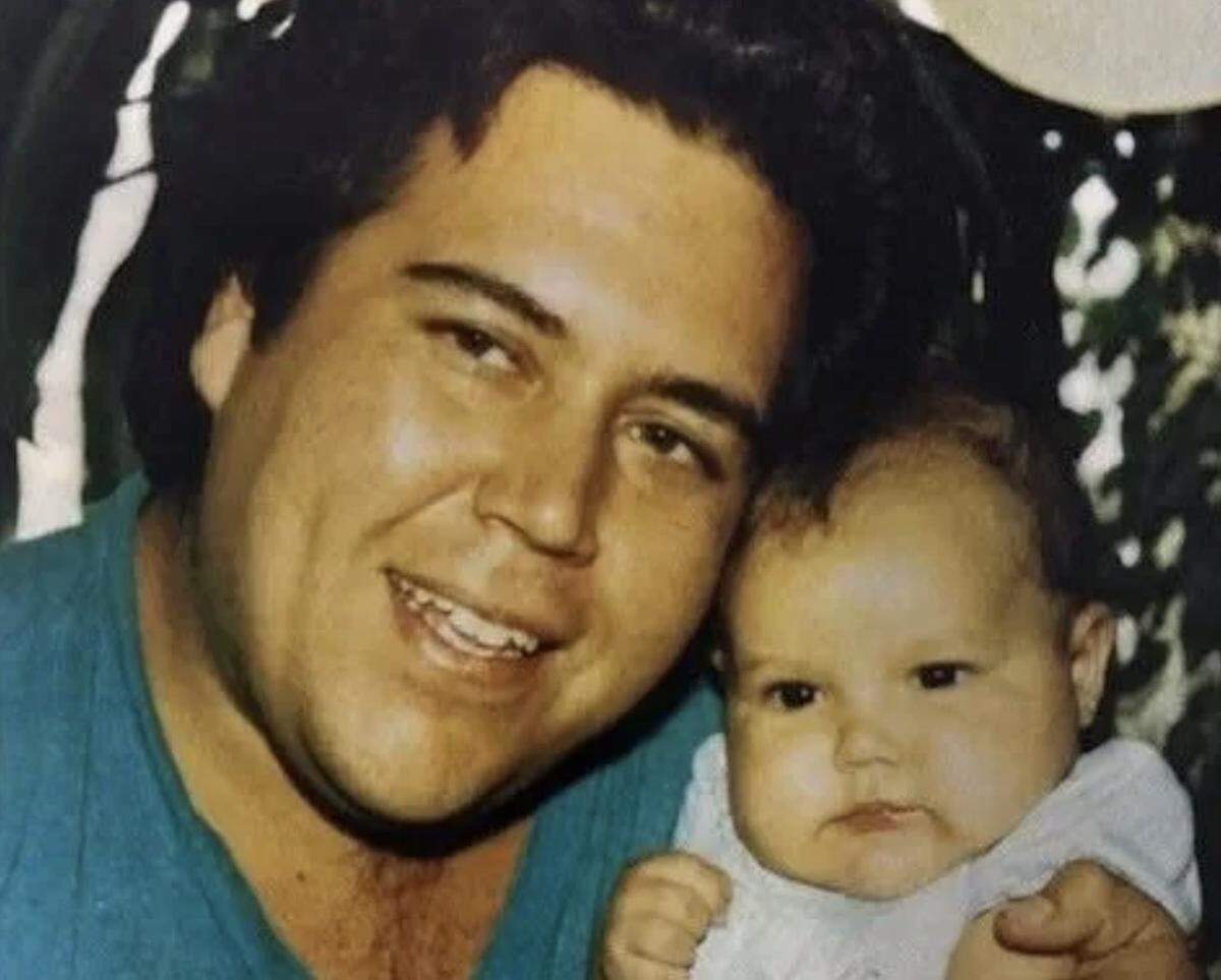 Zachary Jackson, a Modesto native, is seen in this photo with his young child. Jackson was found shot to death inside his Hayward home in 1993.