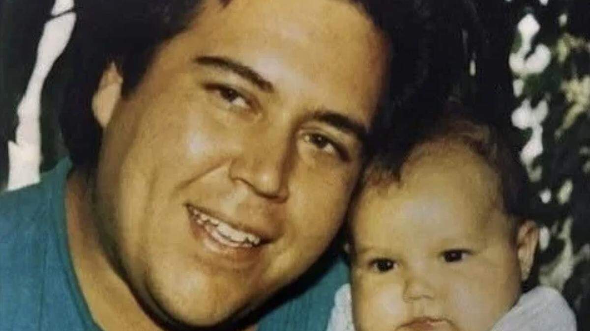 Zachary Jackson, a Modesto native, is seen in this photo with his young child. Jackson was found shot to death inside his Hayward home in 1993.