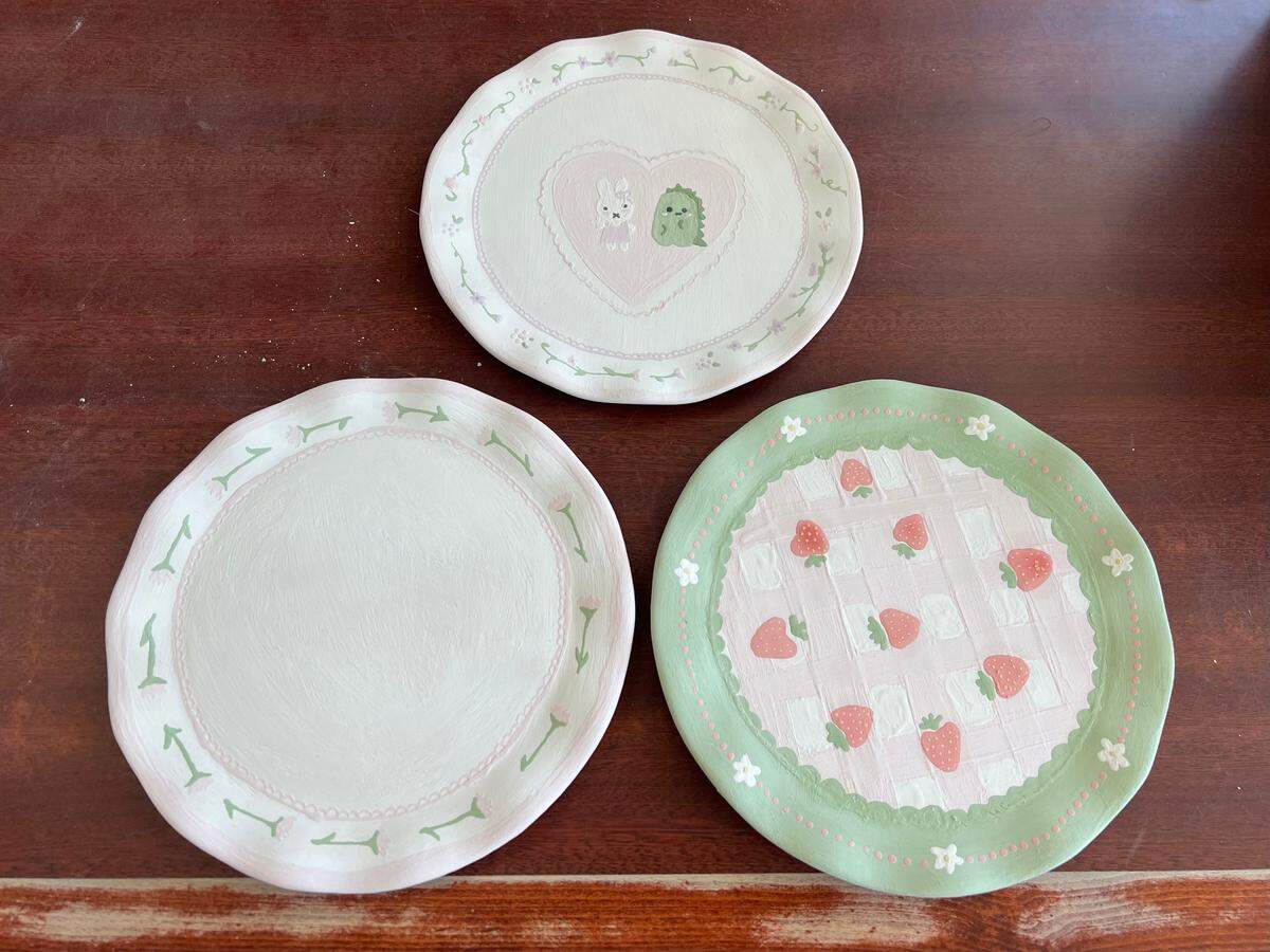 Painted ceramic plates at Pottery Magic Modesto.