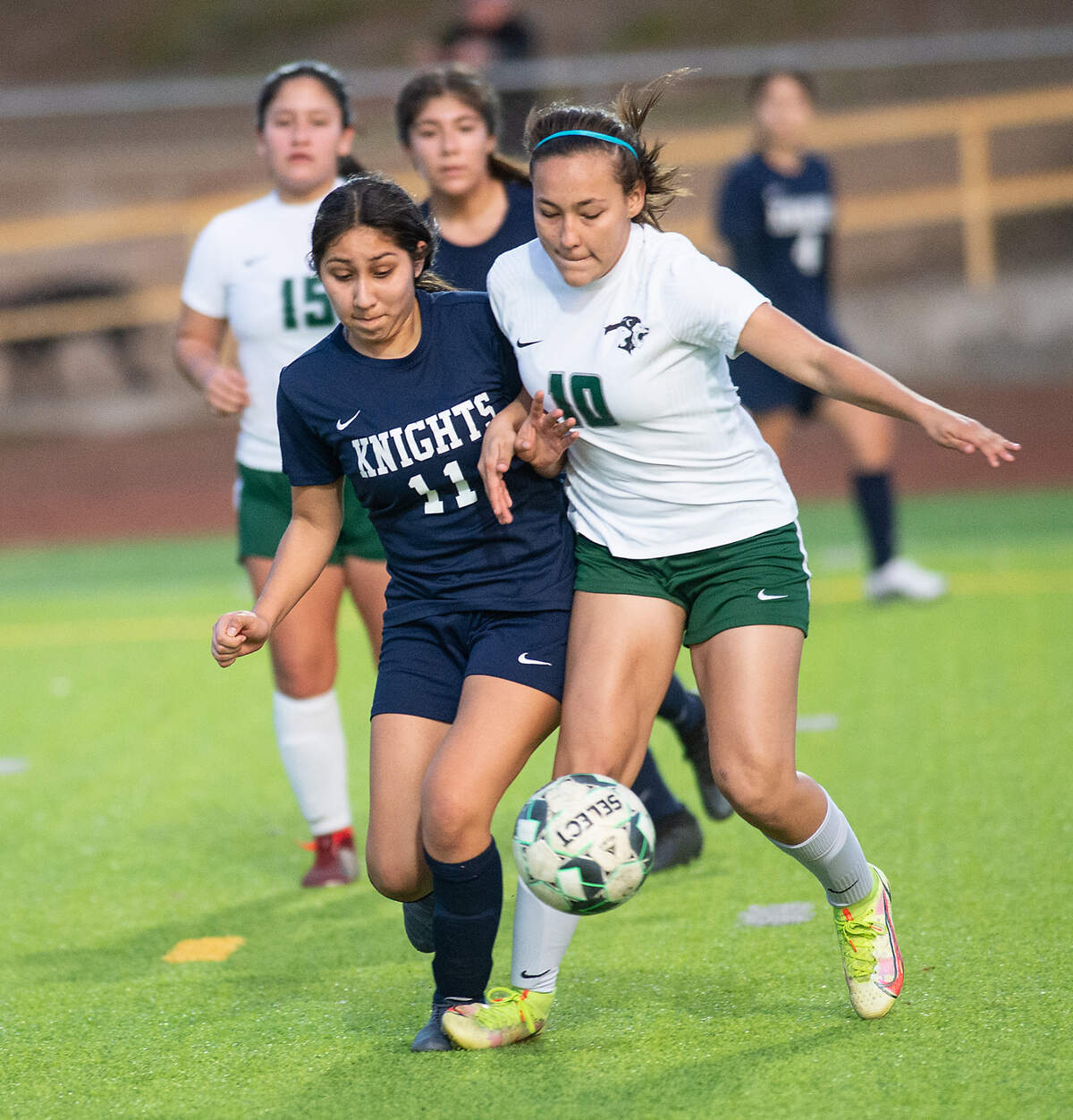 Pitman’s Lillyana Rodriguez (10) and Downey’s Yajaira Romero-Zamorano battle for the ball during the Central California Athletic League game at Downey High in Modesto, Calif., on Tuesday, Jan. 4, 2022. Pitman won the game 6-0.