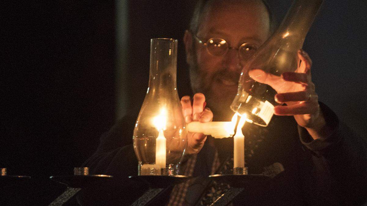 Rabbi Shalom Bochner lights the Hanukkah menorah in 2017 at McHenry Village in Modesto.