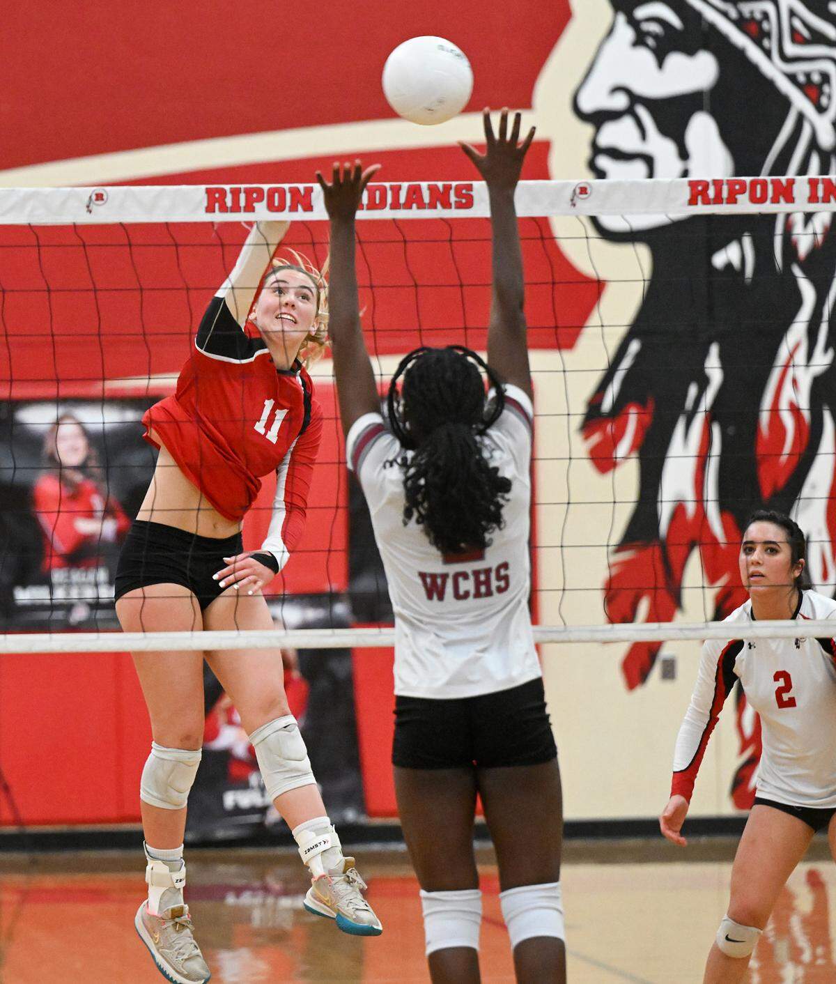 Ripon’s Adriana Dorn (11) spikes the ball during the Division IV semifinal playoff match with West Campus at Ripon High School in Ripon, Calif., Tuesday, Oct. 31, 2023.