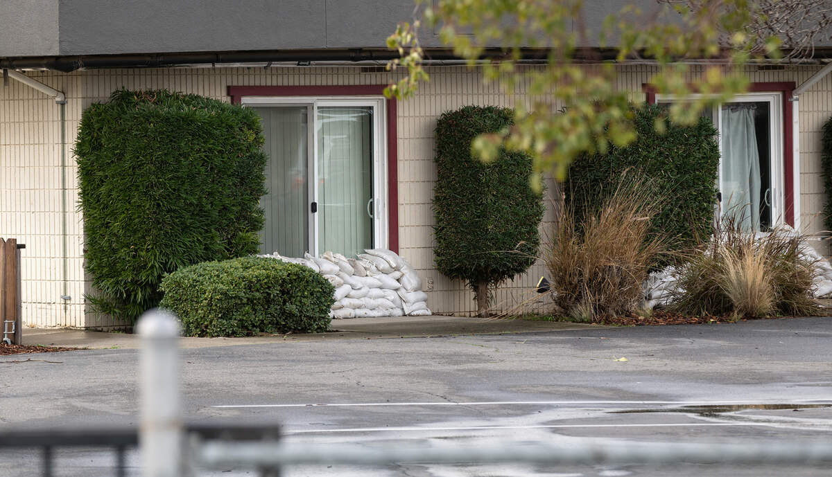 Doorways were secured with sandbags at San Luis Care Center in Newman, Calif., Tuesday, Jan. 10, 2023.The senior care center was evacuated Monday due to anticipated flooding.