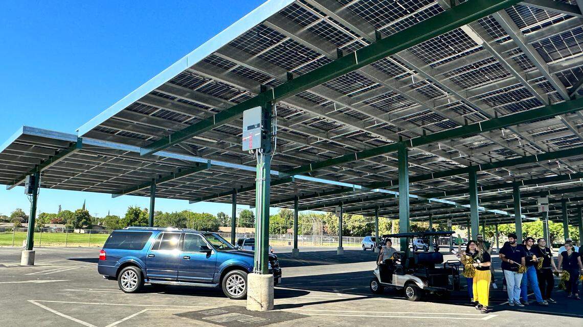 Cars are parked beneath a Davis High School solar panel on Monday, July 31, 2023.