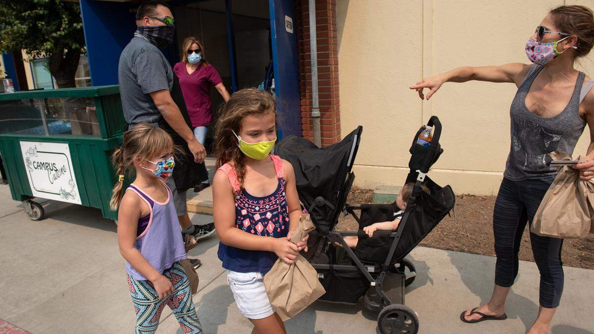 People mask up at Hughson Elementary on Sept. 9, 2020.