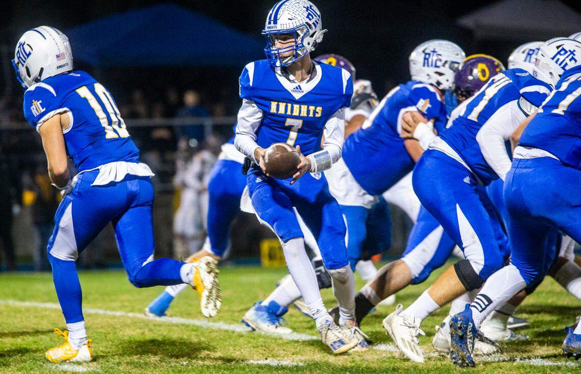 Ripon Christian quarterback Mason Tameling (7) looks back for the handoff in the Sac-Joaquin Section Division VII-A Championship against Orestimba on Friday, Nov. 17, 2023 at Ripon Christian High School.