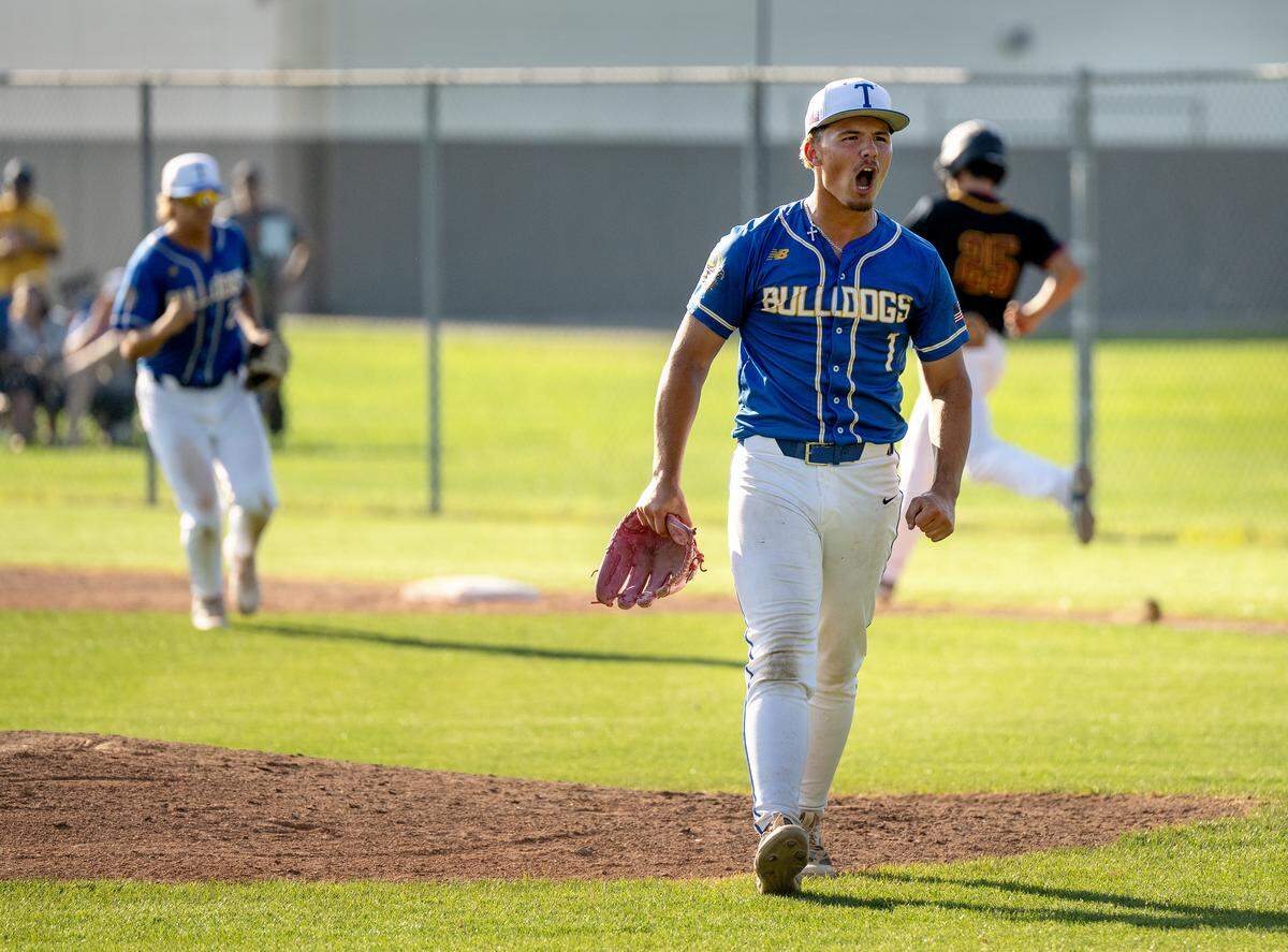 Turlock’s Cameron Henard reacts after throwing a complete game in the Sac-Joaquin section Division I playoff game with Edison in Turlock on Wednesday, May 6, 2026. Turlock won the game 8-1.
