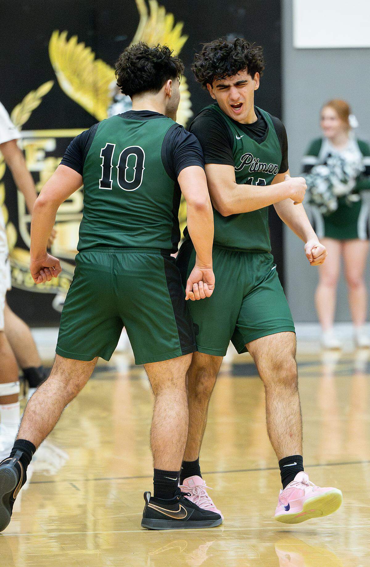 Pitman’s Abhiraj Cheema, right, and teammate Kaulin Davoud (10) celebrate a late game basket and foul during the Central California Athletic League game with Enochs at Enochs High School in Modesto, Friday, Jan. 24, 2025.