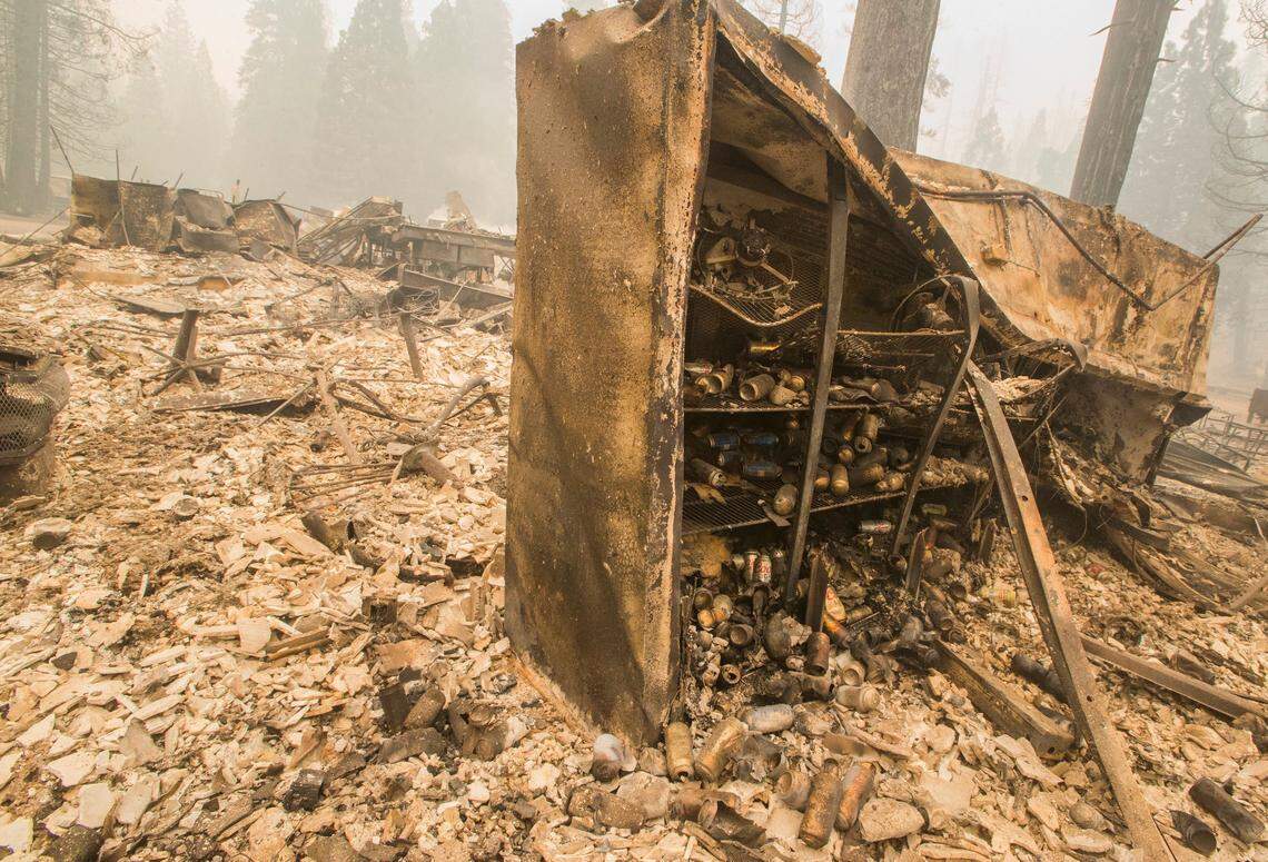A cooler box that held beer at the Dardanelle Resort store stands with its surroundings destroyed after a wind whipped fire  exploded in the area Sunday evening Aug. 5, 2018. As of Monday Aug. 6, 2018 the Donnell Fire in Tuolumne County has grown to 11,074 Acres according to the U.S. Forest Service. 