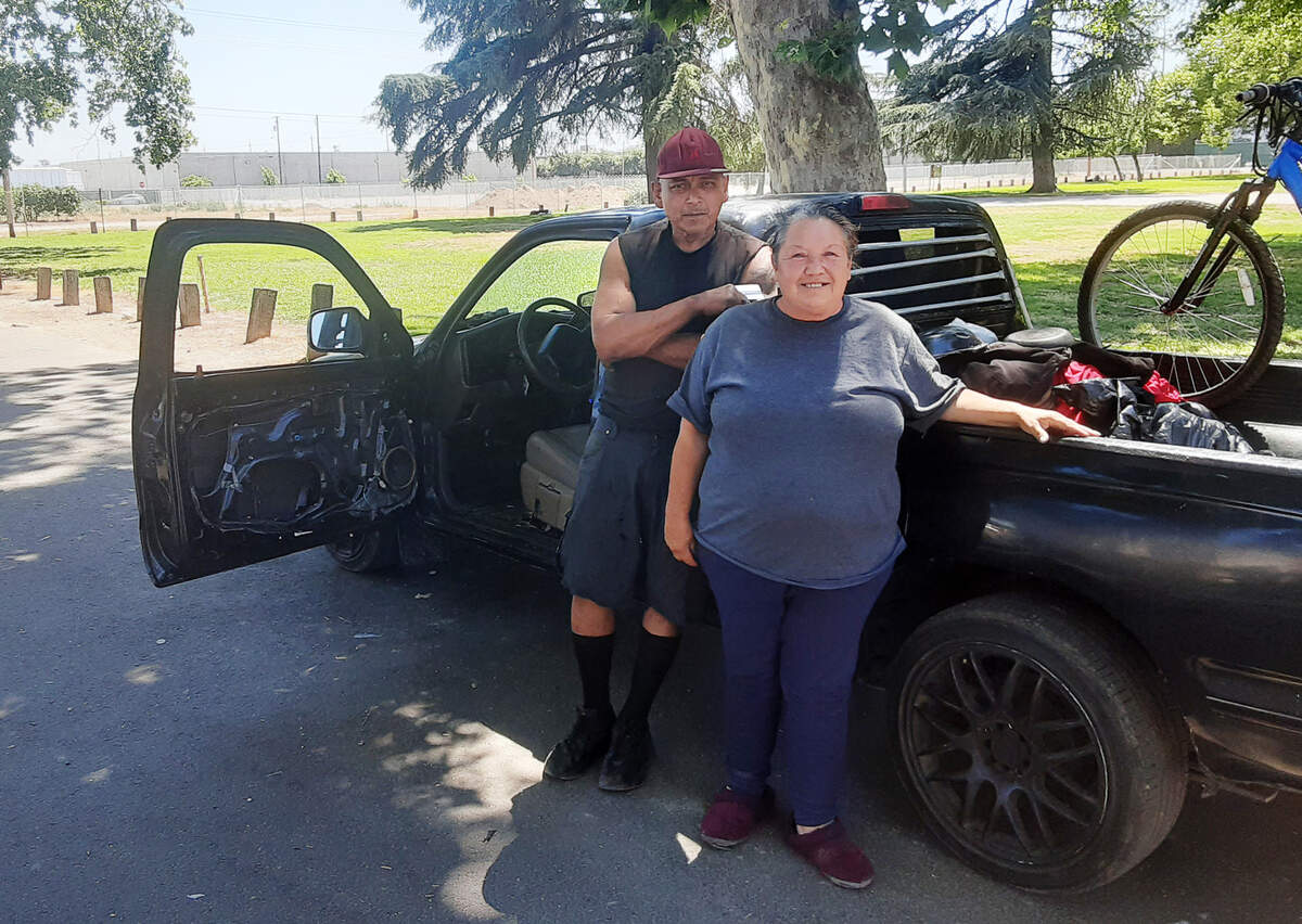 David and Linda Estrada have been living in their 2000 Toyota pickup by Mono Park in Modesto for a couple of months. They are pictured Monday, June 13, 2022, by the park. They support the city’s safe parking proposal for people who live in their vehicles.