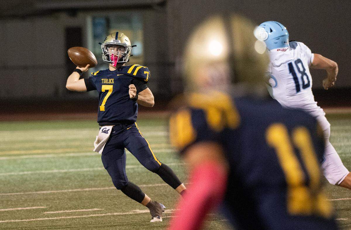 Turlock quarterback Scout Silva makes a pass during the Central California Athletic League game with Downey at Turlock High School in Turlock, Friday, Oct. 18, 2024.