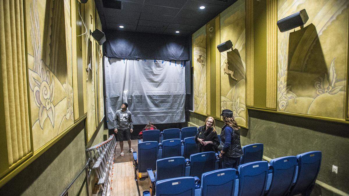 Kirstie Boyett (second from right) tours the new theater with Paradigm Construction owner Danny Savage (left) and his family, at the State Theatre on Saturday, Dec. 21, 2019, in Modesto, California.