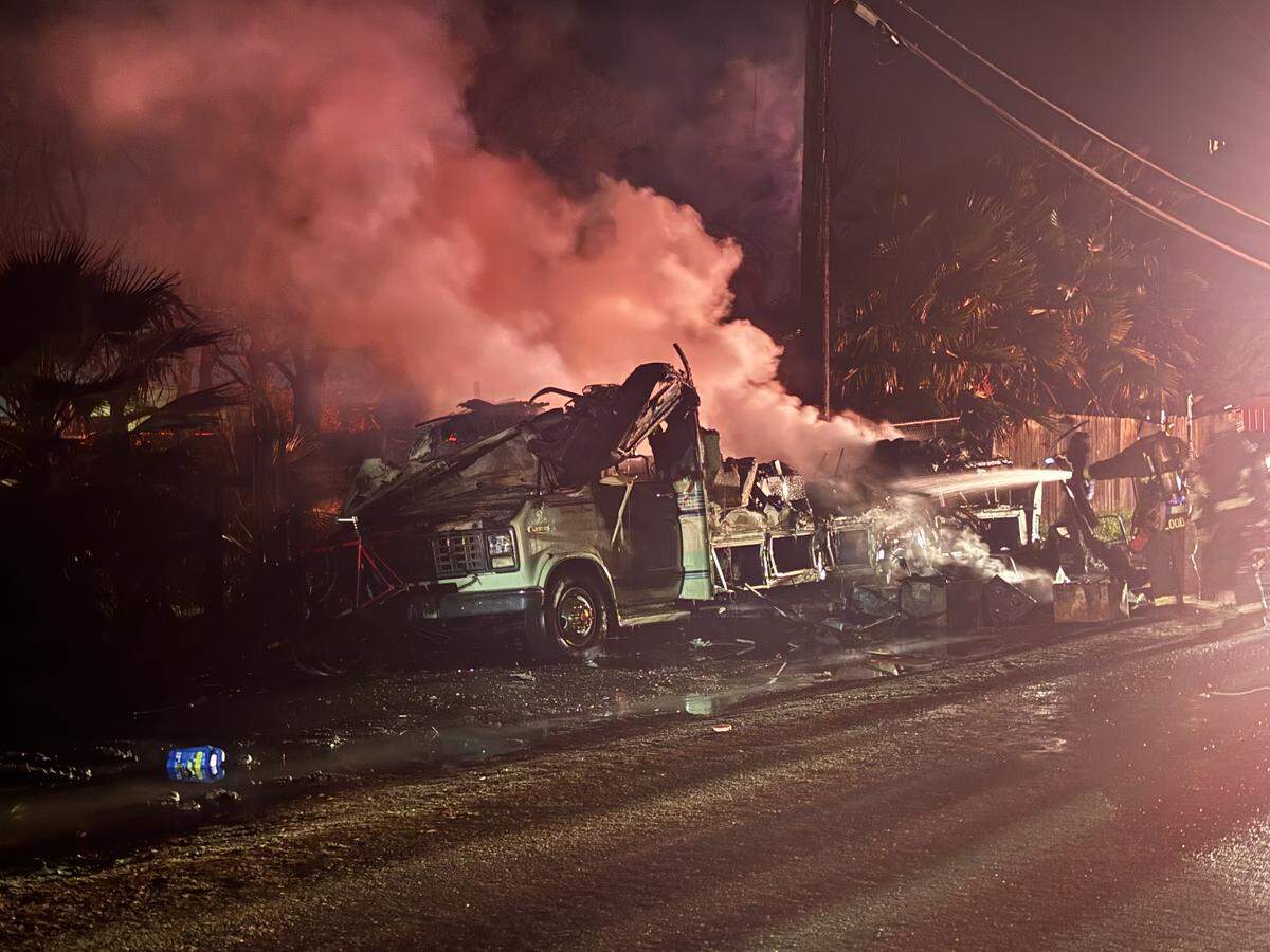 Firefighters extinguish a fully involved RV fire near Olivero and Crows Landing roads in south Modesto. One dog was found dead inside the vehicle.