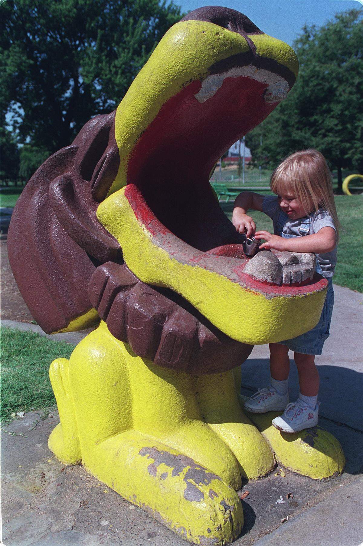 In this July 31, 2000, photo, Stockton resident April Lynn, then 2, takes a drink straight from Leo the lion’s mouth at Beard Brook Park in Modesto.