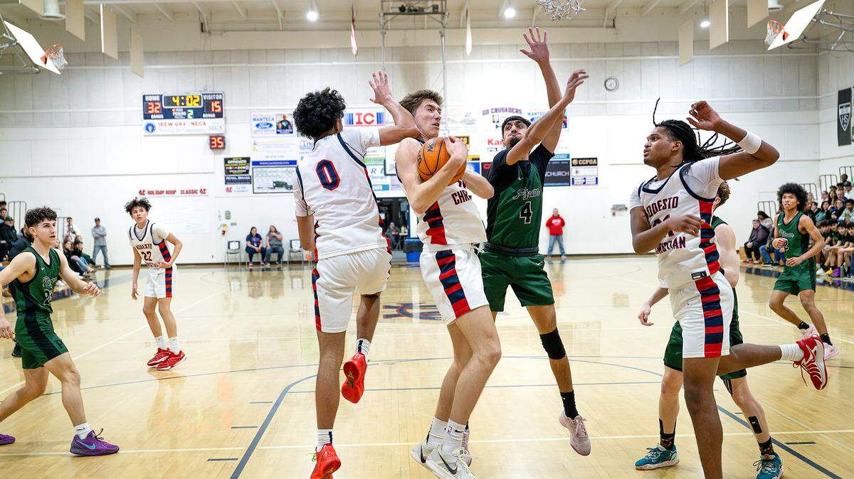 Modesto Christian’s Ry Atkins grabs a rebound during the Sac-Joaquin Section Division I playoff game with Pitman at Modesto Christian High School in Salida, Wednesday, Feb. 19, 2025. Modesto Christian won the game 74-35.