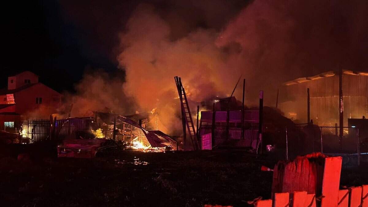 Multiple fire agencies from throughout the county sent resources to battle a massive barn fire Friday night, April 18, 2025, in the 200 block of Poppy Avenue in Patterson.