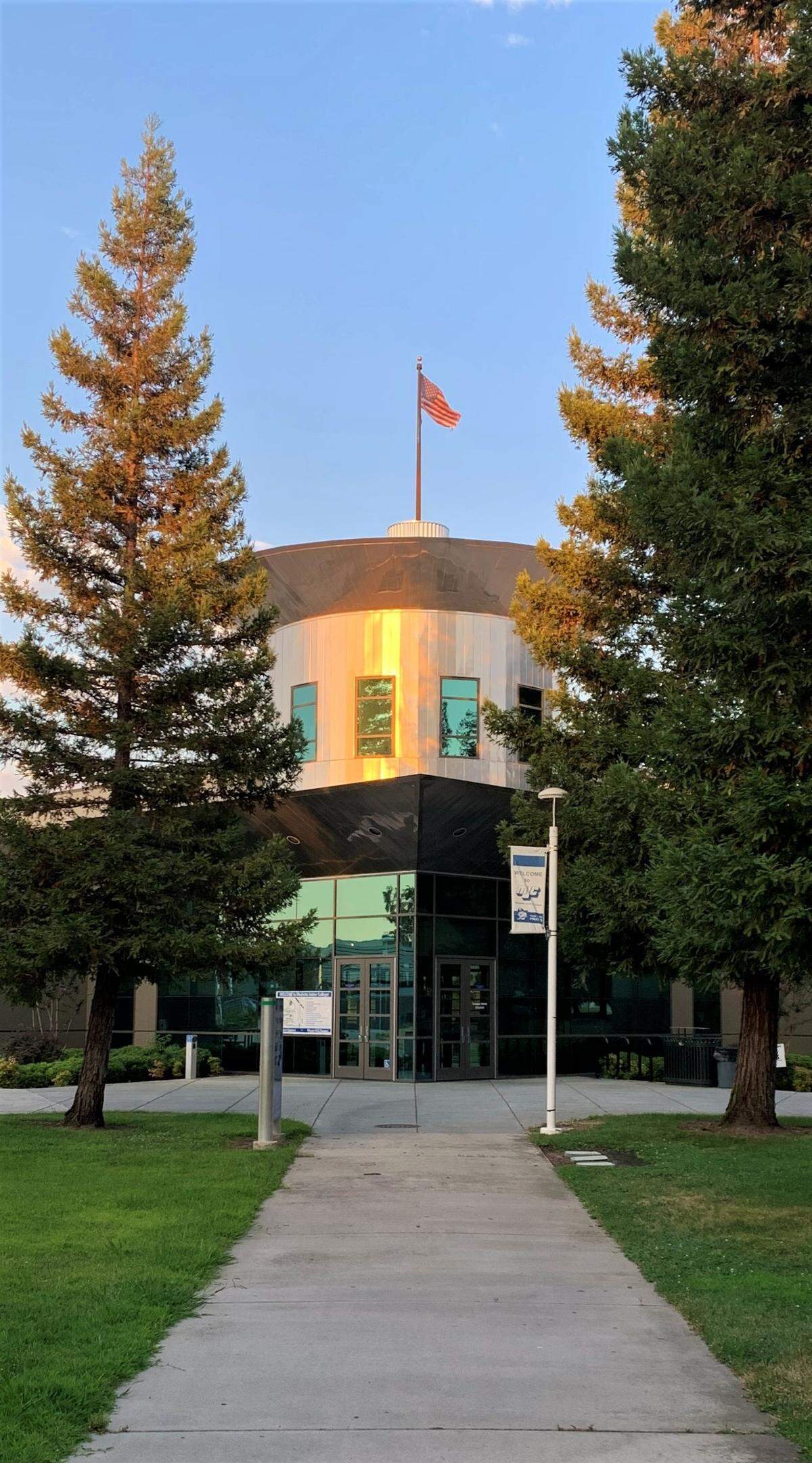 The American flag blows in the wind on a warm summer evening on Modesto Junior College’s picturesque west campus on Sunday, July 26, 2020.