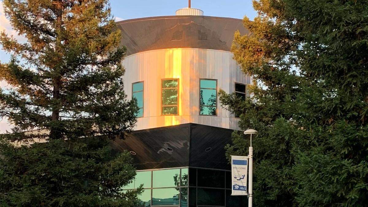 The American flag blows in the wind on a warm summer evening on Modesto Junior College’s picturesque west campus on Sunday, July 26, 2020.
