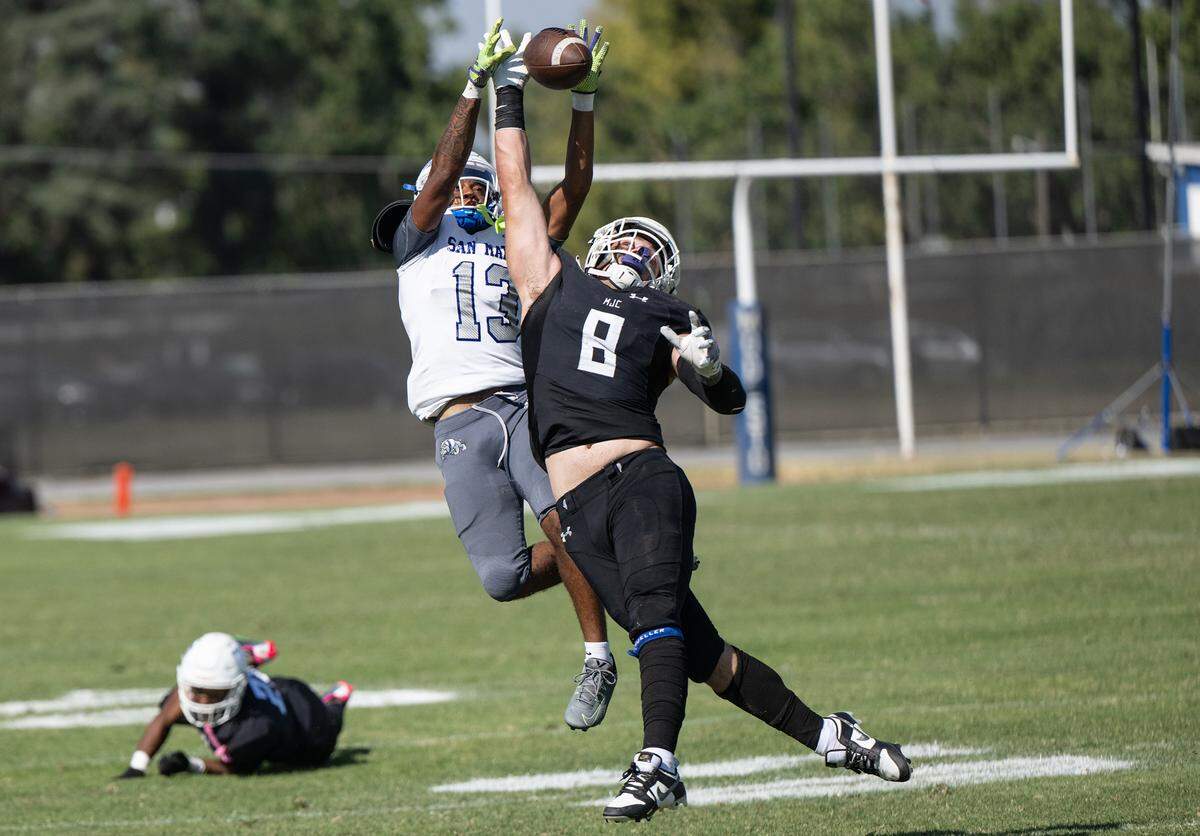 Modesto’s Kyle Jackson (8) breaks up a pass intended for San Mateo’s Anthony Freeman during the game at Modesto Junior College in Modesto, Calif., Saturday, Sept. 16, 2023.