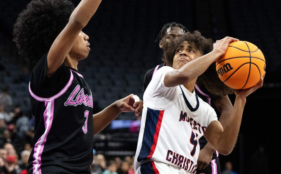 Modesto Christian’s Ross Widemon looks to shoot under pressure from Lincoln’s Elijah Holmes in the Sac-Joaquin Section Division I championship game at the Golden 1 Center in Sacramento, Calif., Wednesday, Feb. 21, 2024.