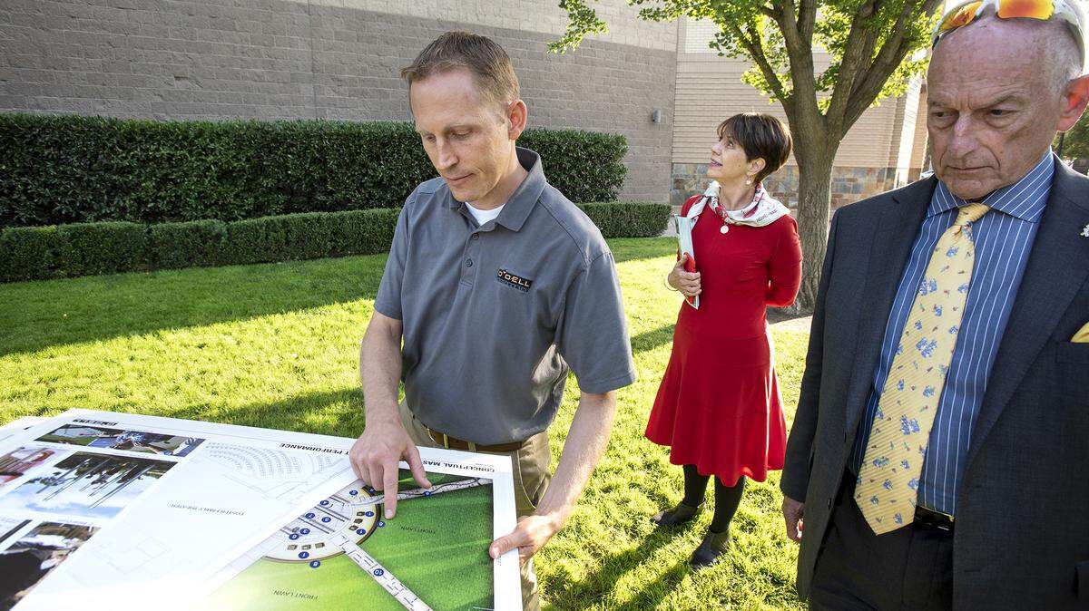 Designer Chad Kennedy, left, Modesto Rotary president Phil Trompetter, right, and Gallo Center CEO Lynn Dickerson show the concept plans for the interactive outdoor music garden at the Gallo Center for the Arts in Modesto, Calif., Thursday, Oct. 10, 2019.