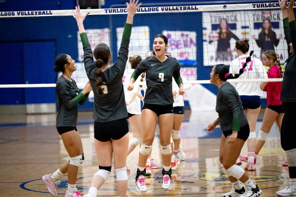 Pitman’s Alyssa Moreno (9) and teammates celebrate a point in the Central California Athletic League match with Turlock at Turlock High School in Turlock, Calif., Tuesday Oct. 8, 2024.