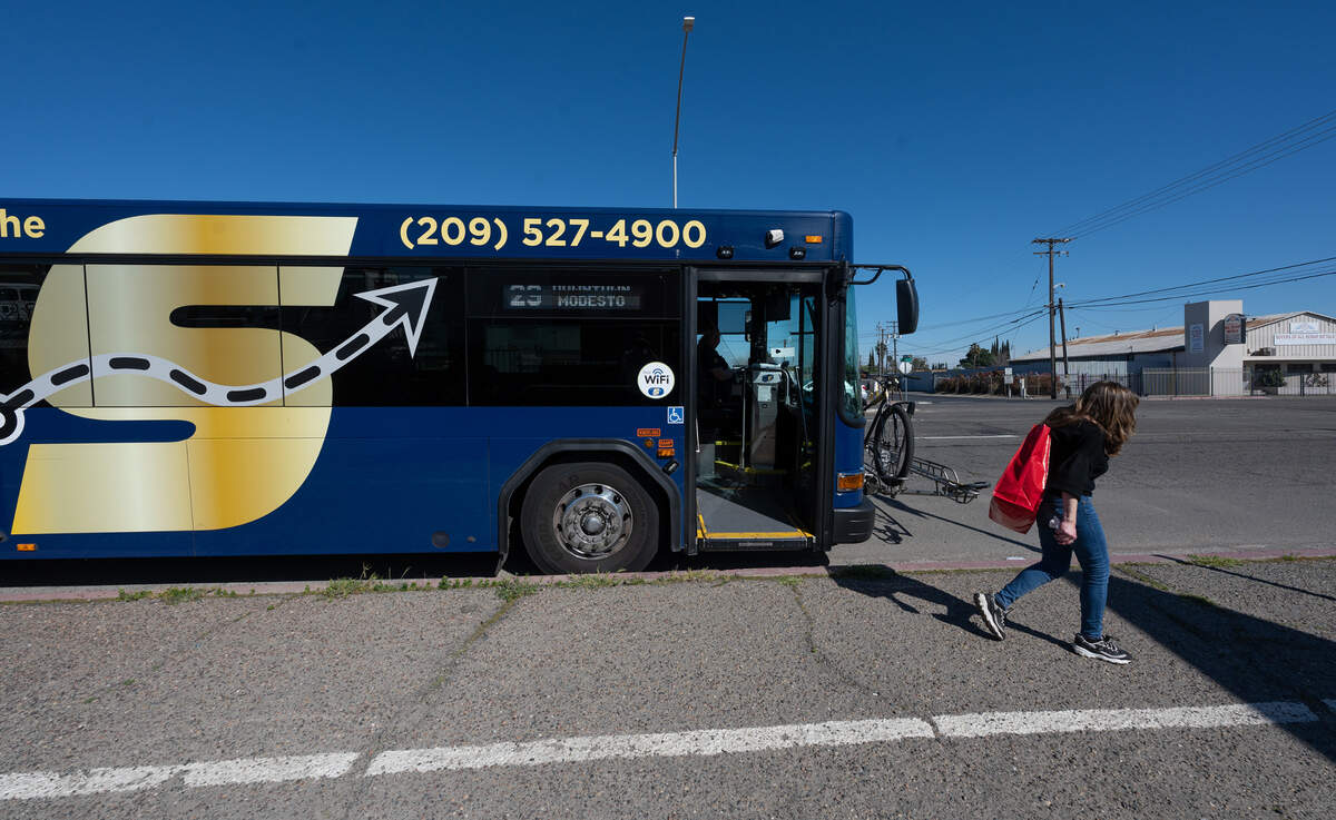 A rider gets off a StanRTA bus on South Ninth Street at Hosmer Avenue in Modesto, Calif., Saturday, March 16, 2024.