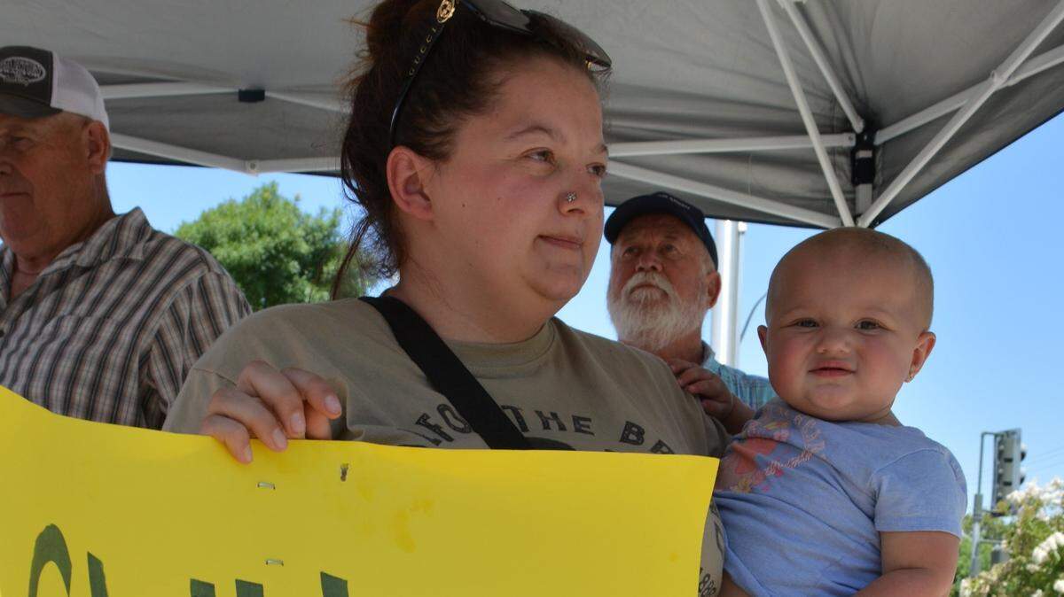Megan Bellamy brought her 11-month-old daughter, Sofie, to a protest against the pending release of sex offender Kevin Gray outside the Turlock Police Department on June 21, 2024.