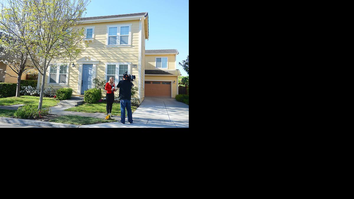 
A news crew reports Wednesday on the seeming abduction of Denise Huskins in front of the home where she lived in Vallejo. Late Wednesday, police called the kidnap an elaborate hoax. Police search dogs and divers had sought clues to her wherabouts on Tuesday, a day after she was reported kidnapped. 
