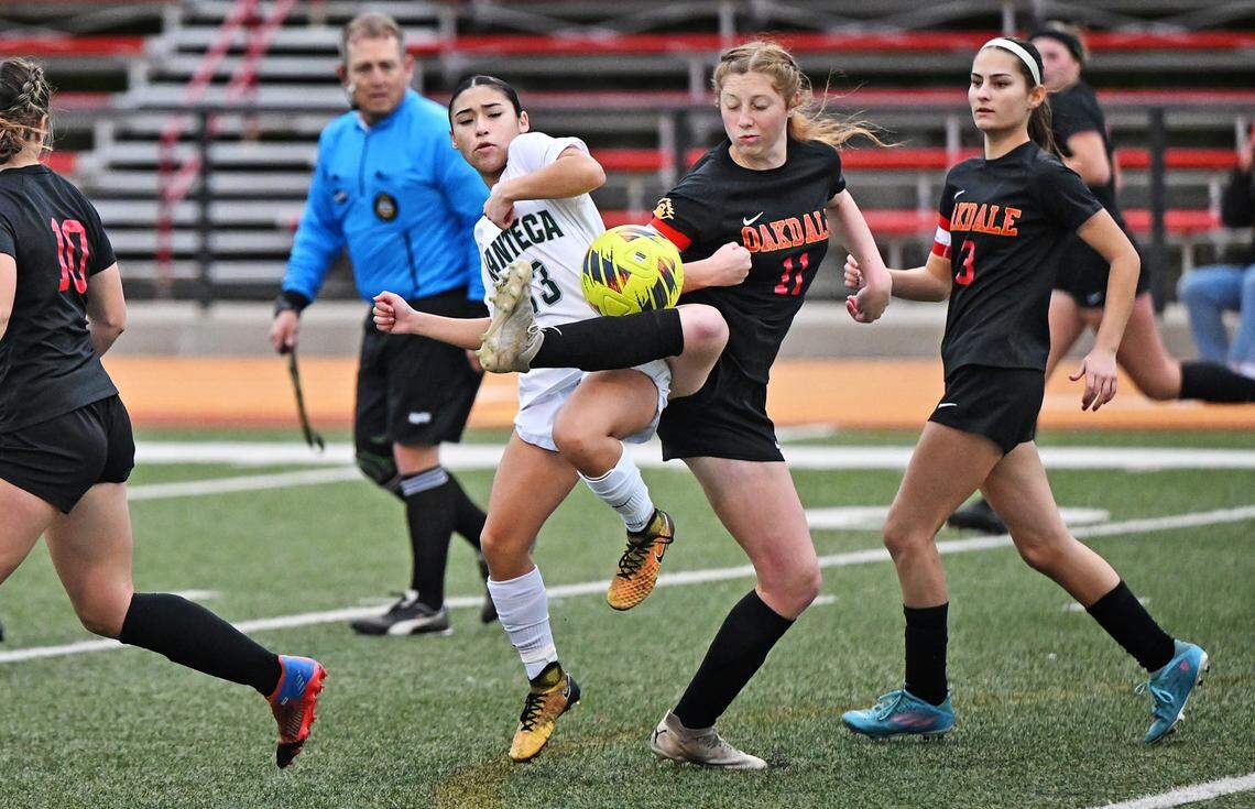 Oakdale’s Claire McGee Brown and Manteca’s Kailee Jackson clash during the Sac-Joaquin Section Division III semifinal game in Oakdale, Calif., Friday, Feb. 16, 2024.