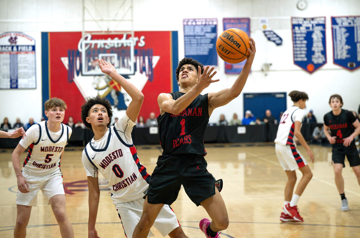 Buchanan’s Desmon Patton scores on a layup during the Holiday Hoop Classic championship game with Modesto Christian at Modesto Christian High School in Salida, Monday, Dec. 30, 2024.