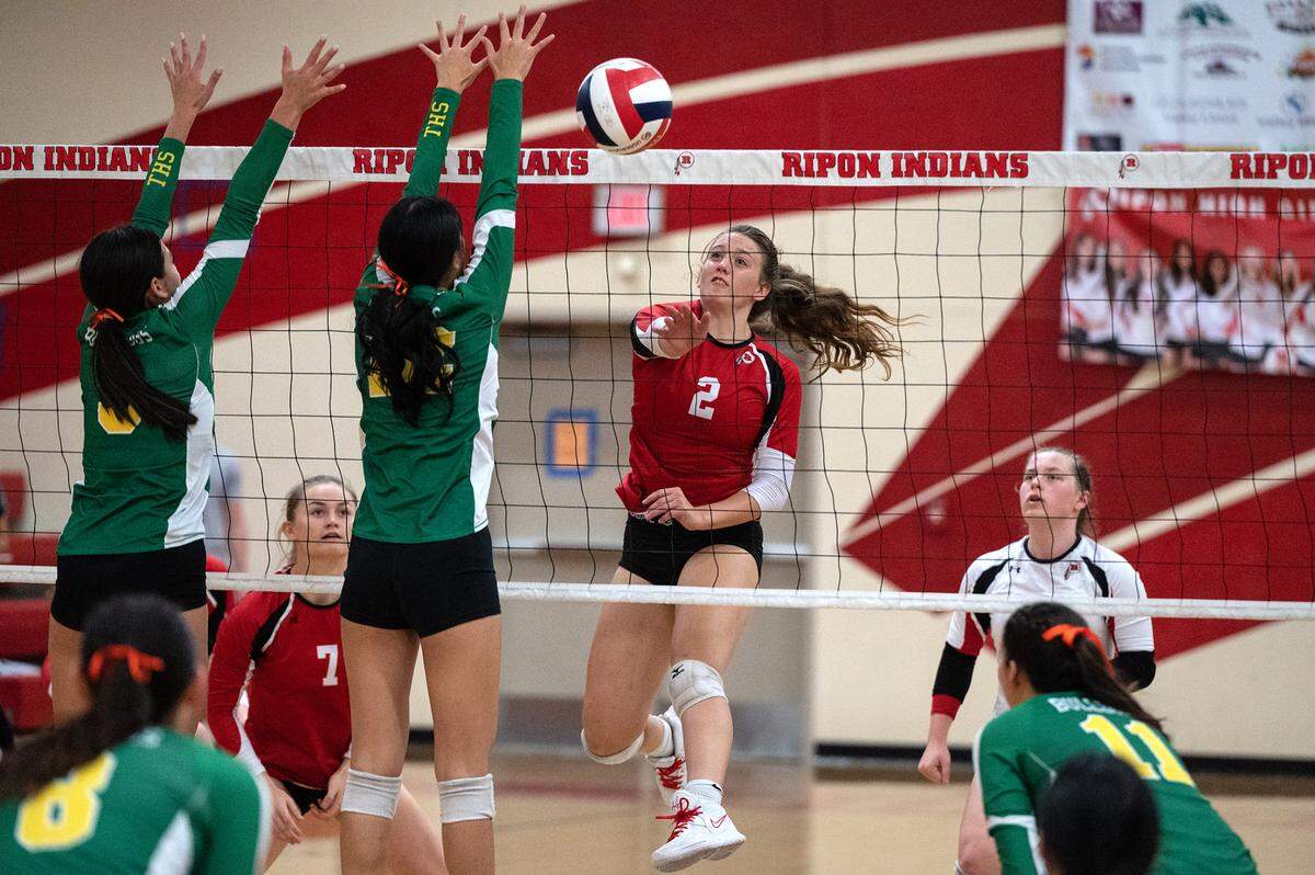 Ripon’s Makenzie Loechler (2) spikes the ball up the center of the court during a non-league match with Tracy in Ripon, Calif., on Thursday, September 22, 2022. Tracy won the match 3-2.